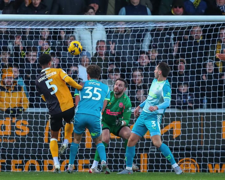 Players at goal scoring own goal