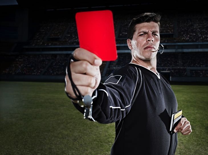 Ref holding up a red card
