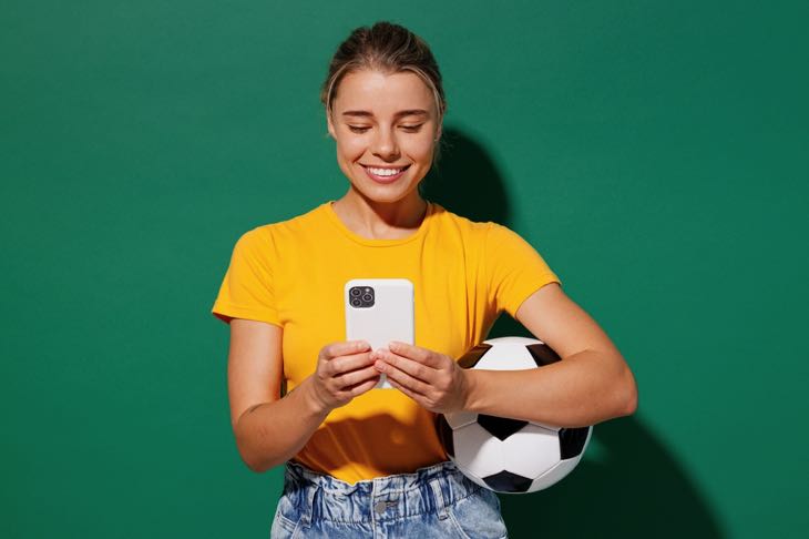 Woman on phone with football